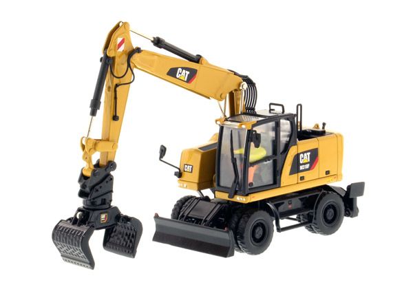 DCM85508 - Escavatore gommato CATERPILLAR M318F con autista e scatola metallica - 1